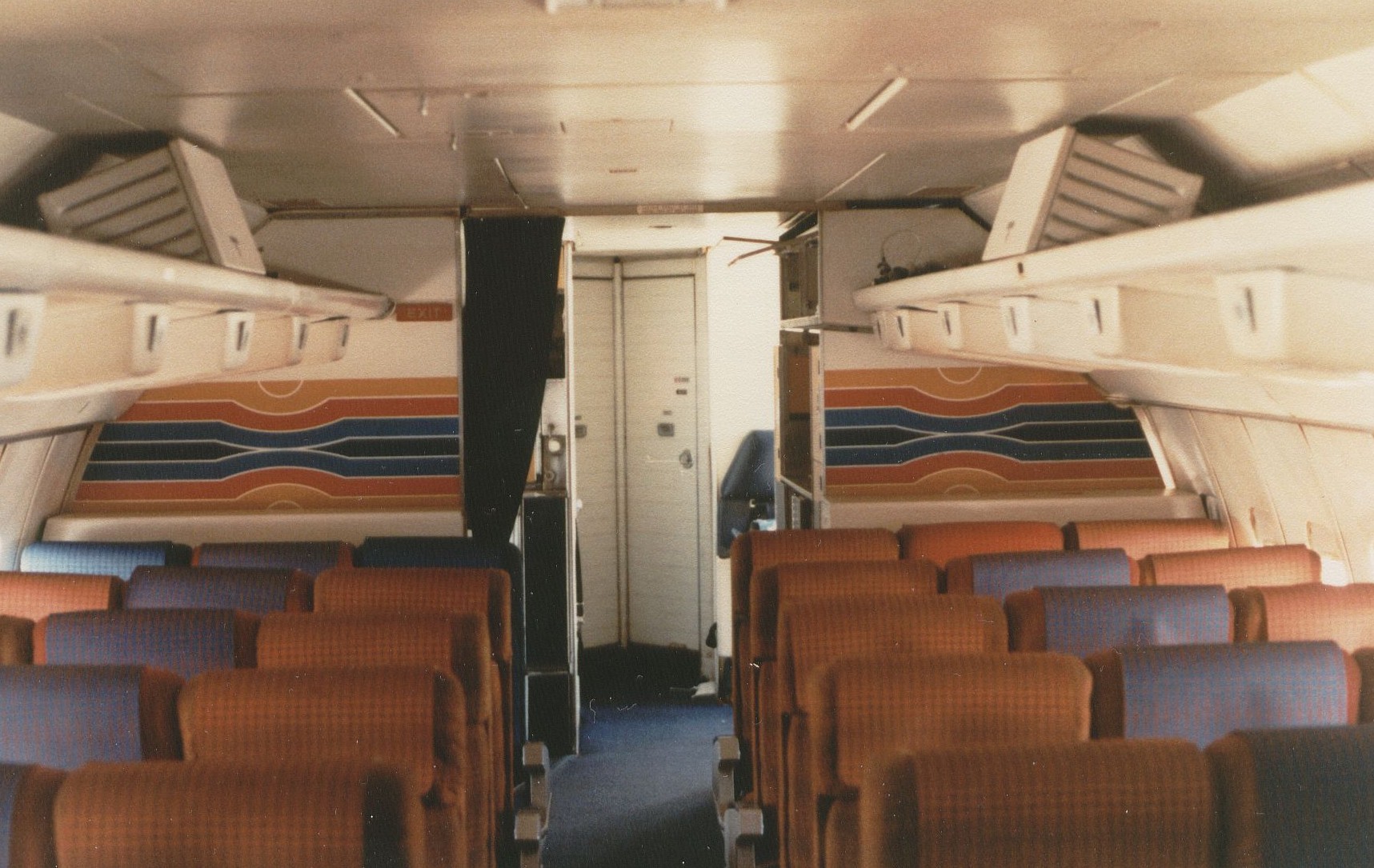 August 1981 The artwork on the rear bulkheads in the economy cabin of a Pan Am 707 were a stylized version of the famous Pan Am globe logo.